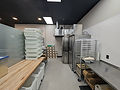 commercial kitchen buildout prep area with stainless coolers