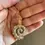 Thumbnail: Spiral PearlStudded Golden Necklace