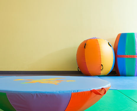 colorful-gym-equipment-against-a-yellow-wall-2026-03-25-02-14-21-utc.jpg