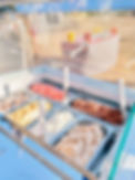 Trays of gelato inside the case of our gelato case that is used at our special events