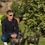 Thumbnail: Guy sat next to two deer in a cable knit jumper