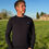 Thumbnail: Guy wearing a Navy Cable knit in a field