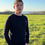 Thumbnail: Man wearing a navy cable knit jumper