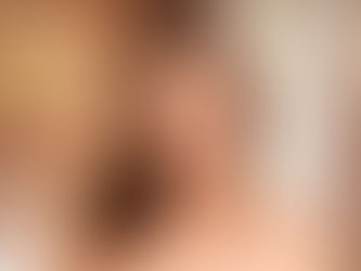 Julia Morozzi in a festive red Santa outfit and scarlet stockings posing by a decorated Christmas tree for the SexArt “Perfect Gift” photoset.