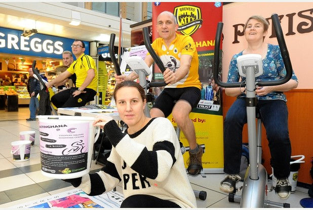Staff from Cooper's Square Shopping centre riding all day on static bikes to help raise money for charity.