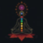 Silhouette meditating in lotus pose on a red floral mat. Chakra symbols and colors are aligned vertically. Radiant mandala overhead. Dark backdrop.