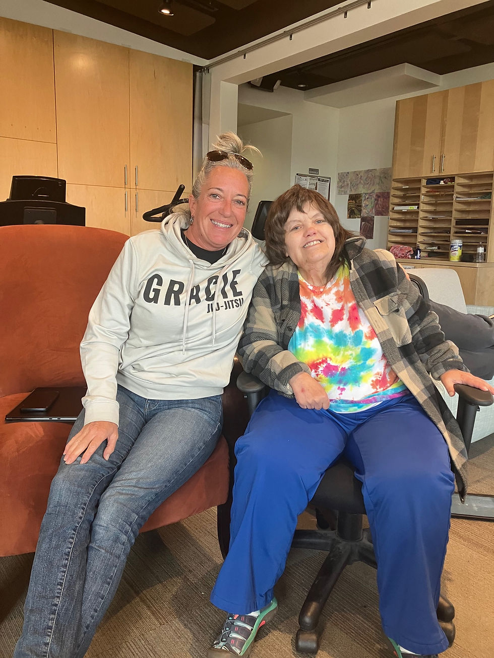 Dani Pevy (left) has been a DSP for about a year after a lifetime of bartending. She loves hanging around with Karla and other clients at the Jackson CES day-habilitation center.