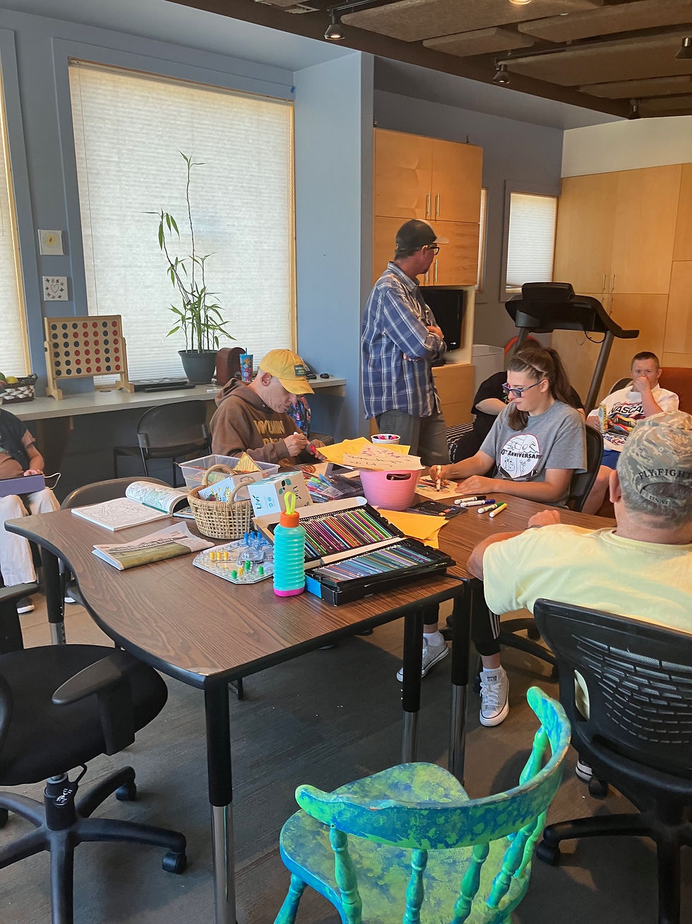 There's always an open chair to join in the conversations and activities of the clients at Day-habilitation in Jackson. Clients and staff read, write, color, play games, or exercise. Weather permitting, clients and staff go walking to the nearby Elk Refuge or a nearby park.
