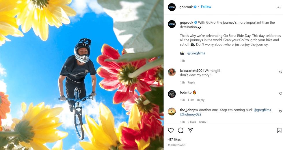 Instagram picture of user generated content which is a man on a bmx doing a stunt with flowers framing the picture
