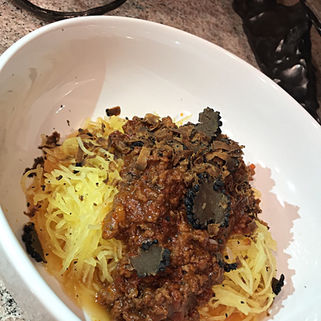 SPAGHETTI SQUASH WITH TUSCAN SAUSAGE BOLOGNESE SAUCE AND BLACK TRUFFLES