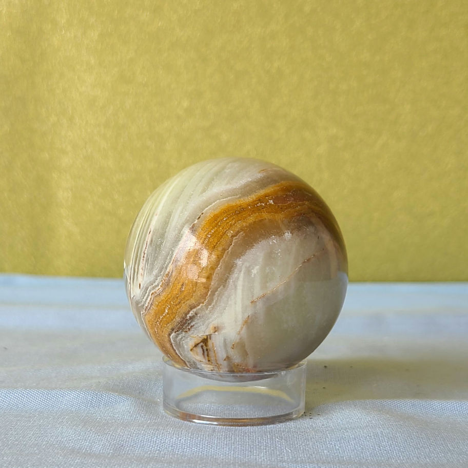 Green and brown striped onyx sphere