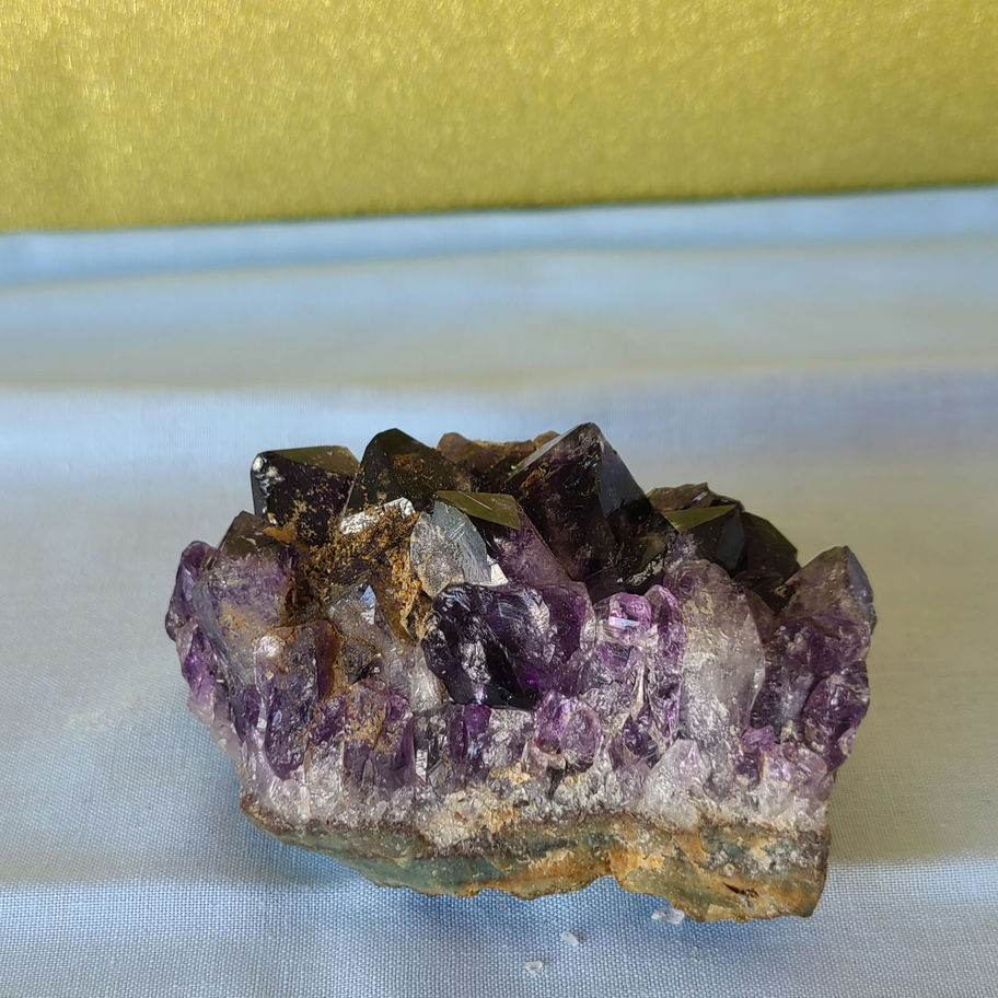 purple amethyst cluster. multiple facets pointing in different directions