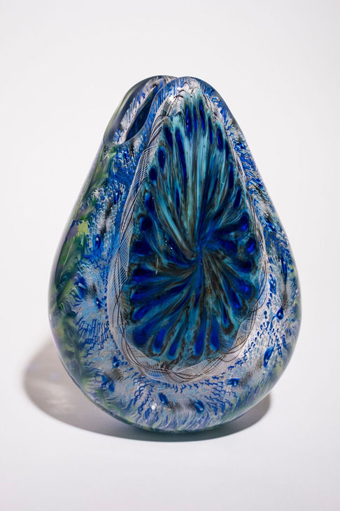 Side view blue and purple tear-drop shaped carved art glass vase