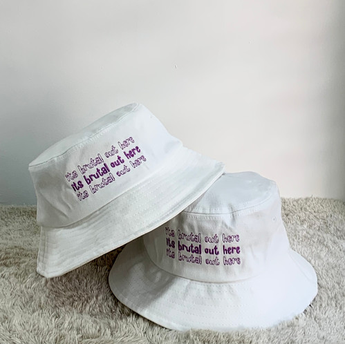 its brutal out here bucket hat 