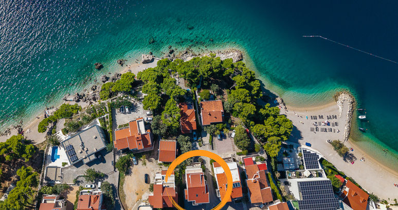 Aerial view of Apartments Bosiljka with the Adriatic coast.