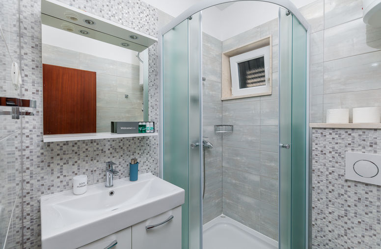 Bathroom with shower in Studio Apartment 2 at Apartments Bosiljka.