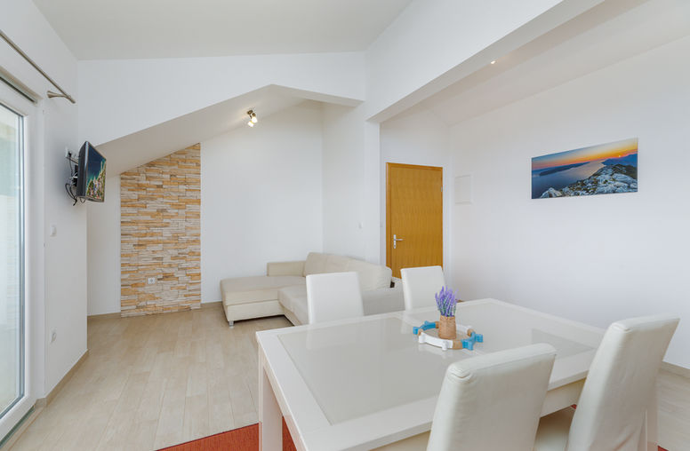 Living room with natural light in Apartment 4 at Apartments Bosiljka.