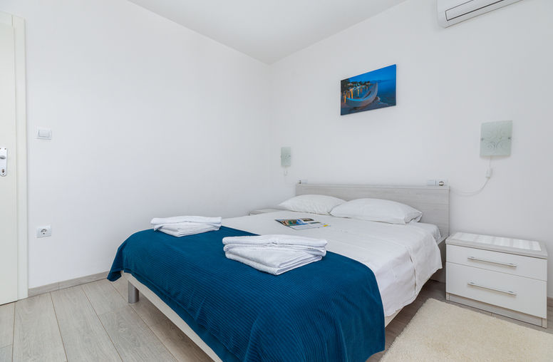 Bright bedroom with double bed.