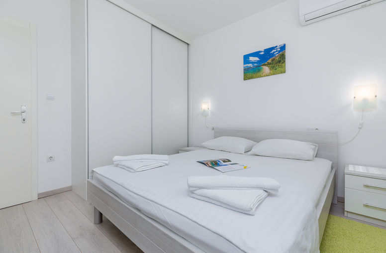 Bedroom corner with natural light in Apartment 3 in Medići.