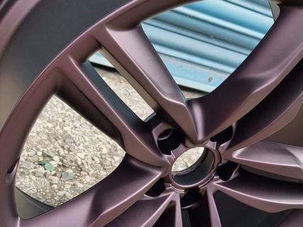 alloy wheel prepared using aqua blasting technique then powder coated to give a bronze metallic finish