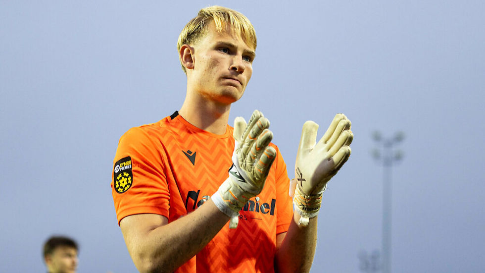 Luke Armstrong applauding supporters.