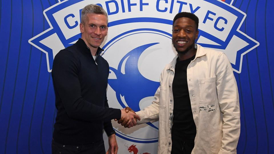 Ebou Adams shaking Steve Morison's hand.