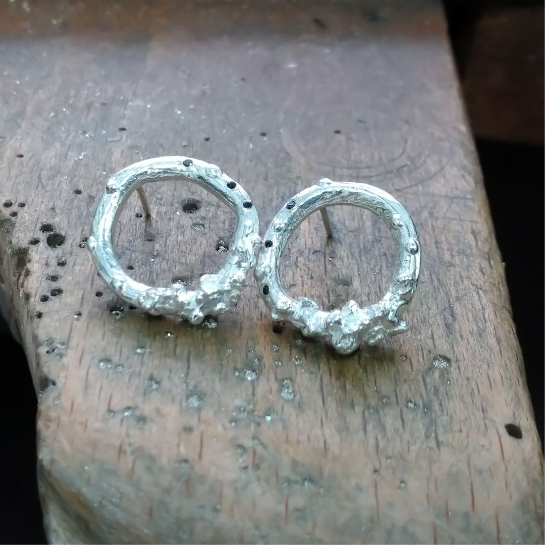 Sterling silver, organic textured full hoops with black spinel