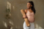 medium-shot-pregnant-woman-holding-yoga-mat.jpg