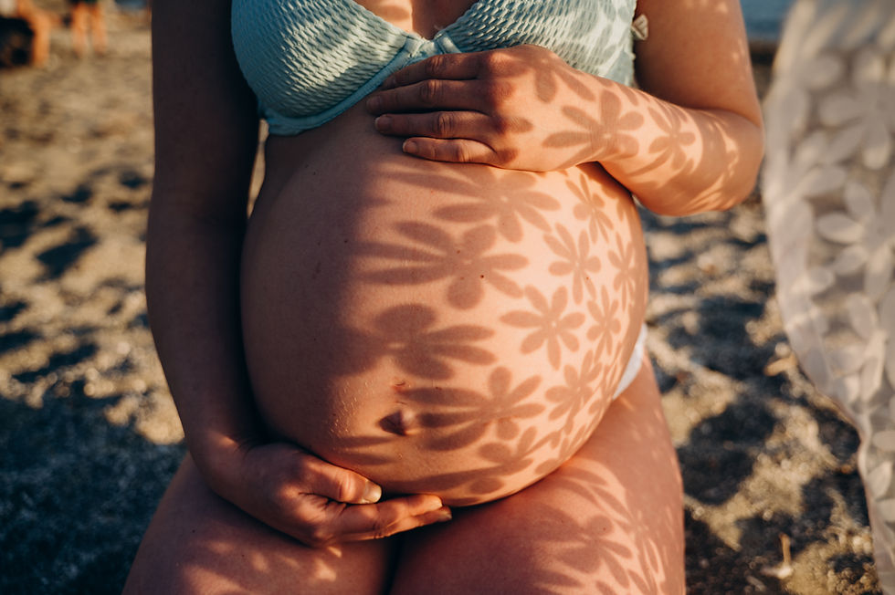 photo-belly-with-baby-beach-with-shadows-from-flowers-falling-belly.jpg