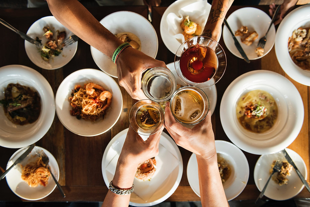 Cozy warm hygge gathering of friends over a good meal