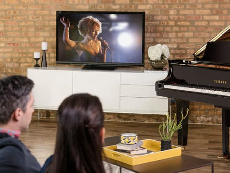 people listening to a Disklavier