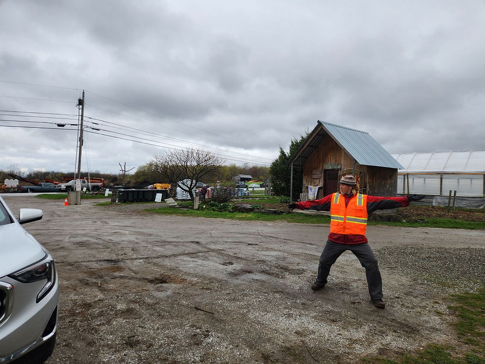 Bryan Dougherty serving as the parking guide at the Annual Tree Sale at Hudak Farm.