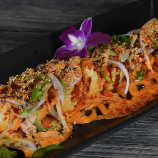 DING DING ROLL $20.99 Inside: lobster, salmon, cream cheese, soy paper Outside: spicy mayo, eel sauce, diabla sauce, mix onion