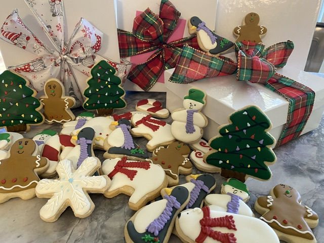 assorted custom decorated christmas cutout cookies in a gift box