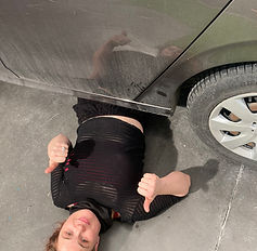Hanging out under a car