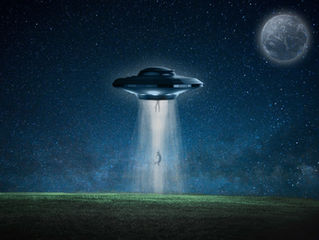 People rising up into a UFO