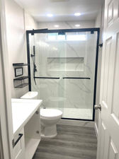 Walk-in tile shower installation with glass enclosure in Linda’s Fremont home