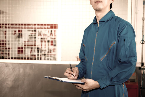 Person In Working Uniform With Notepad_edited.jpg