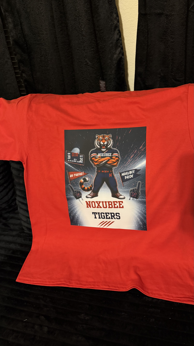 Custom order — a red team tee with a full-colour tiger mascot graphic and school lettering