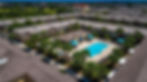 Aerial view multi-building complex, resort style pool, palm trees, roof repair orlando fl.