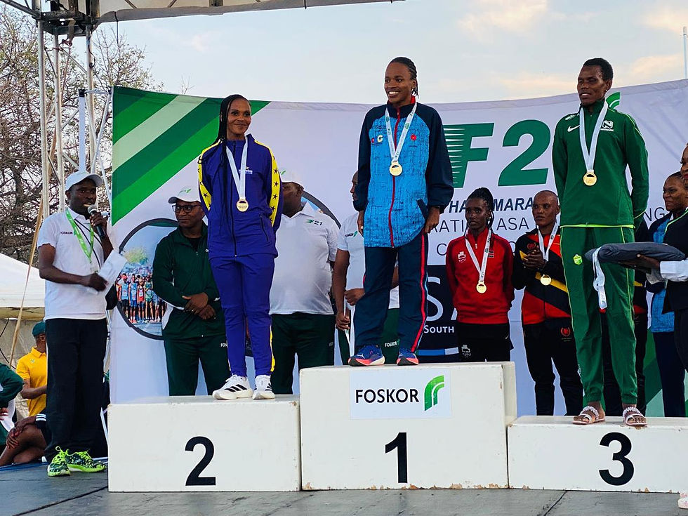 Xaba on top of the podium after claiming victory at the Foskor F21 Half Marathon which incorporated the national 21km championships. Photo Credit: Supplied.