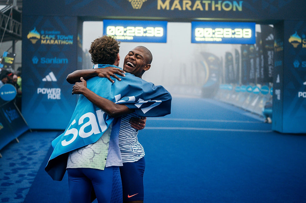 Chaumeton celebrates Ramokhoase's new personal best with him. The 22-year-old Masai Athletic Club top runner smashed his 10km personal best by almost a minute. Photo Credit: Fahwaaz Cornelius.