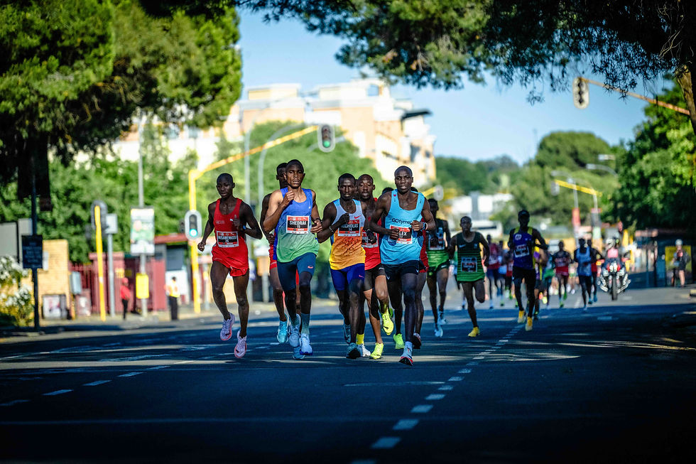 The men's chasing bunch in action before Masai broke away. Photo Credit: Tobias Ginsberg.