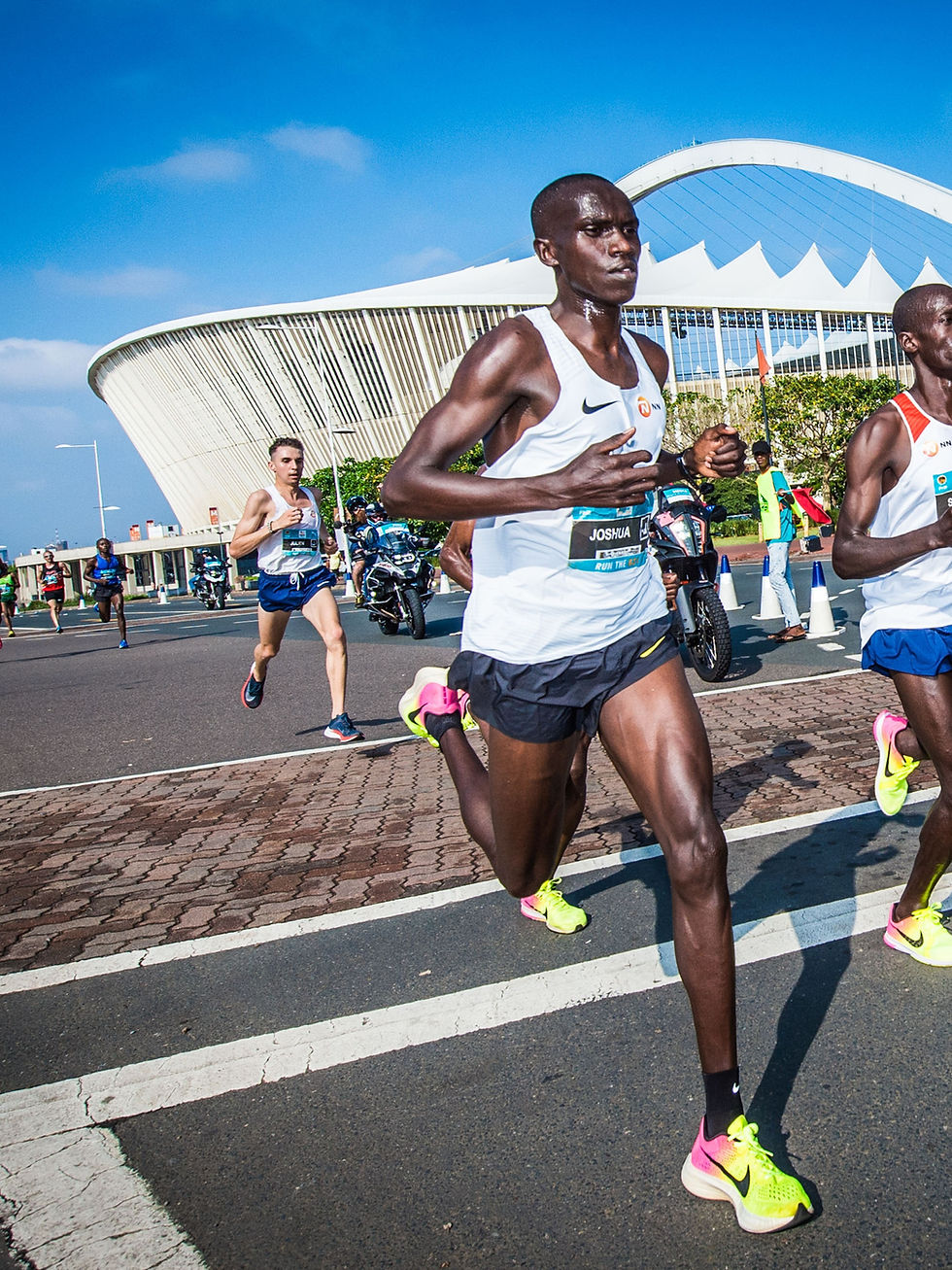 Cheptegei in action during the RUN YOUR CITY DURBAN 10K in 2017. Photo Credit: Tobias Ginsberg.