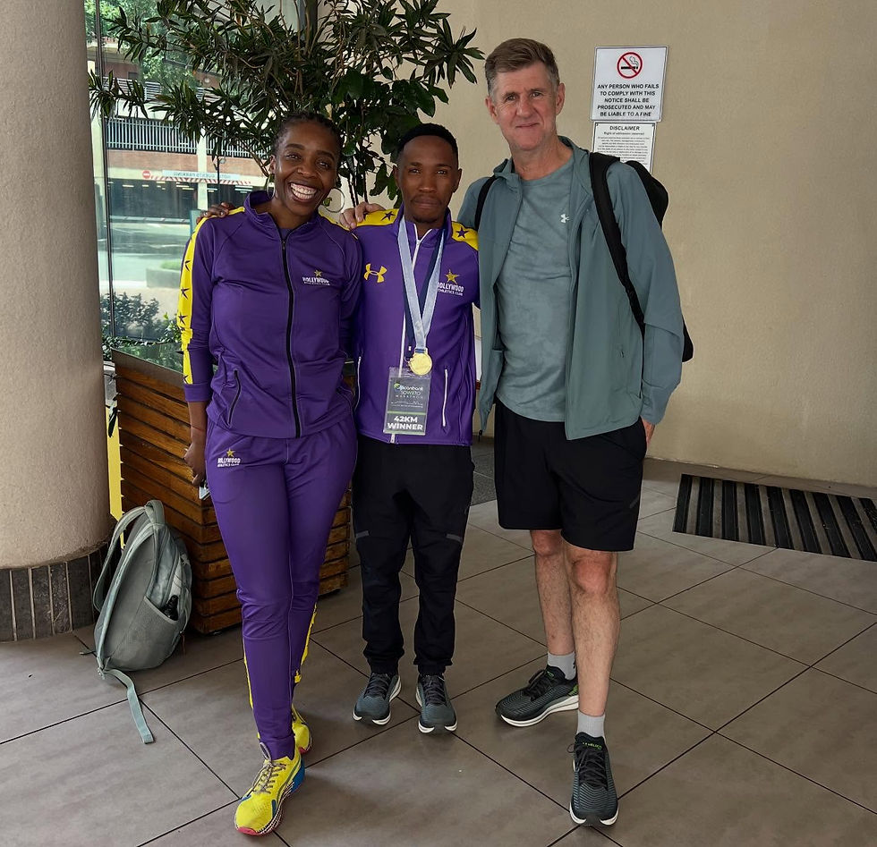 Booyens poses with his athlete Seutloali and Hollywood AC's Cindy Nkomo. Booyens is leading the charge to ensure that his athlete is paid. Photo Credit: Supplied.