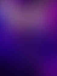 A cave stalagmite formation known as The Angel illuminated with blue and purple light