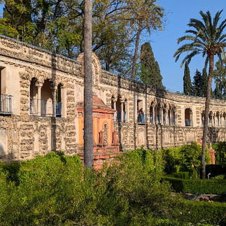 A stone wall with a covered promenade gallery walk