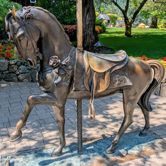 a brass horse carousel figure
