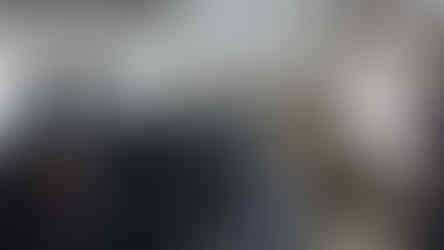 3 models of WWII gunners around a cannon inside the Siege Tunnels