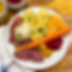 a plate with potatoes, peas pudding, root vegetables, and corned beef